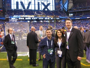 On the field at Super Bowl XLVI with Brian Lowe and Kraft Sports Productions' Nick